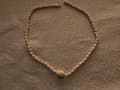 Estimaciones de Joyas: Una Evaluación del Collar de Perlas de Marfil de 37 cms