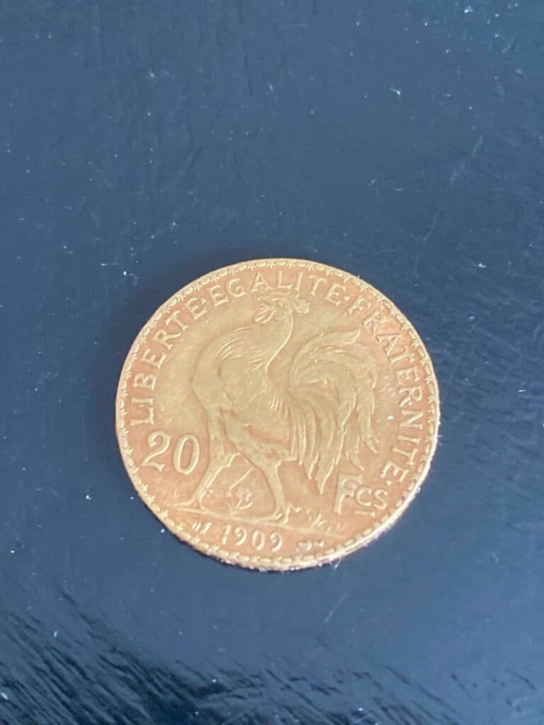 Tasación de una medalla en moneda francesa de 20 francos en oro de 1909 y 1914 en buen estado